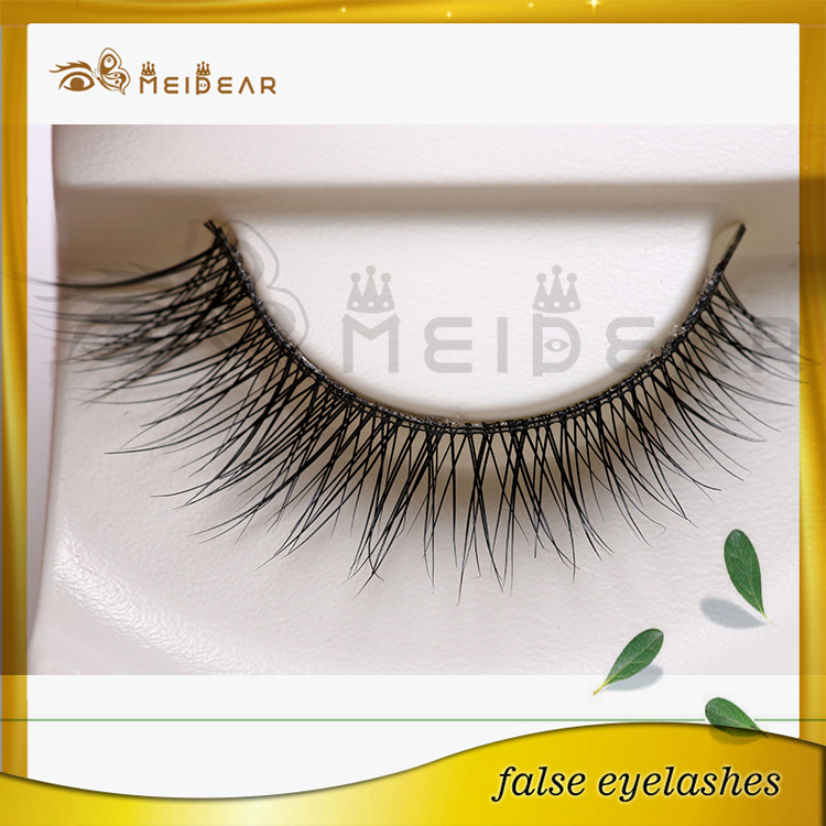 Putting on false eyelashes for make up